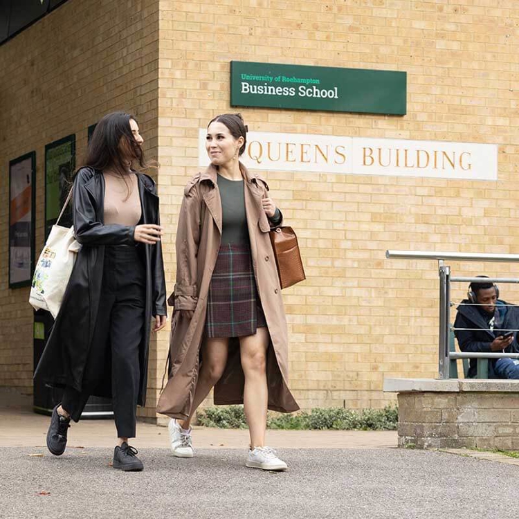 Students walking out of the business school